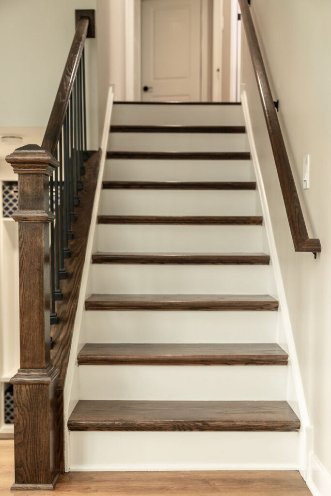 beautifully rebuilt stairs with oak steps and decorative metal spindles